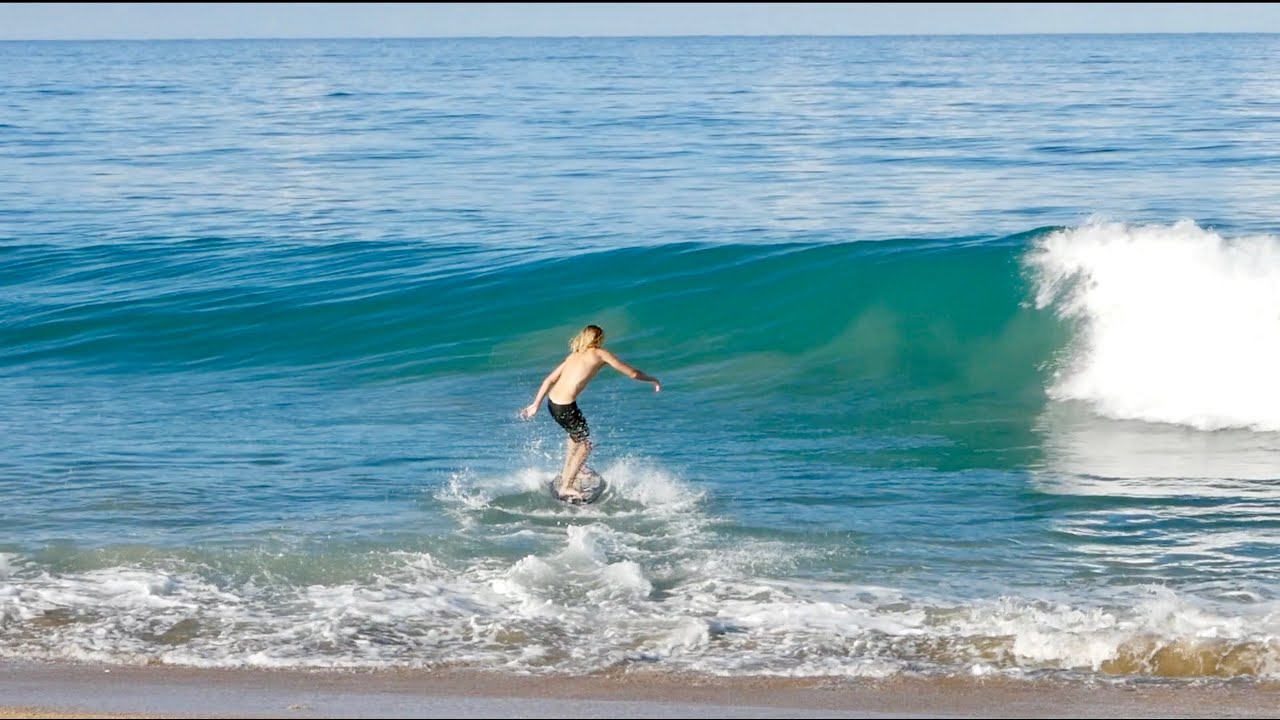 Perfect Point Break for Skimboarding. Professionals Run on to Surfing Wave Perfect Point Break for Skimboarding. Professionals Run on to Surfing Wave