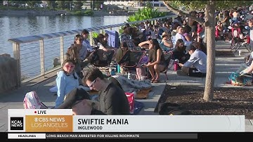 Fans wait for Taylor Swift Eras Tour merchandise