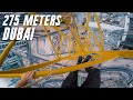 Slippery 275m crane climb in dubai 