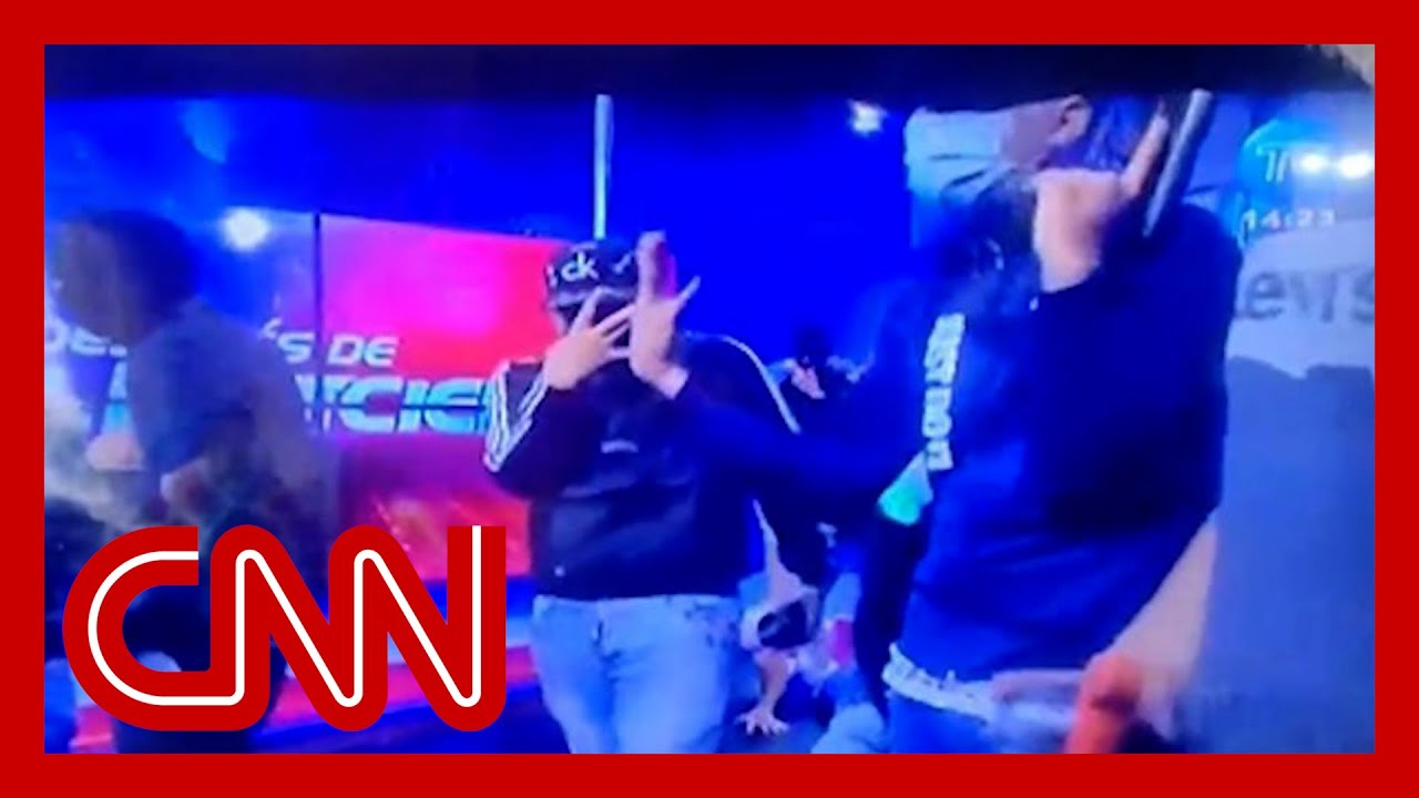 Hooded men take over live TV broadcast in Ecuador