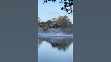 Helicopter crashes into pond while scooping water for wildfire