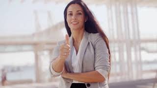 motivated young woman giving a thumbs up motivated young woman giving a thumbs up