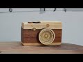 This wooden Leica is a covert music box with rotating 'lens'
