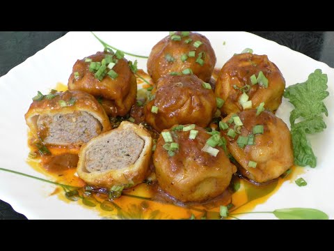 Сочные и очень вкусные замороженные хинкали в сковороде в особом томатном соусе.