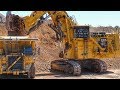 Caterpillar 6060 face shovel loading autonomous trucks