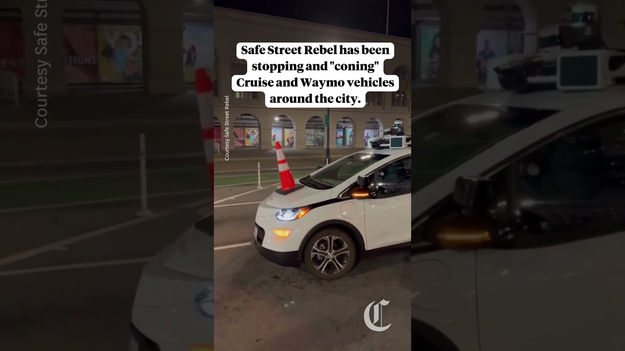 Group of S.F. activists protest driverless cars using orange traffic cones