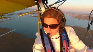 Alina and Emily chatting while flying