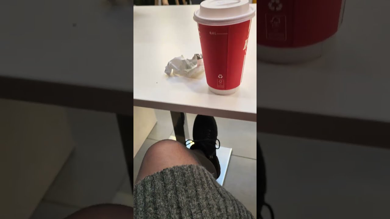 Crossdresser in a gray mini dress. Winter shopping trip.