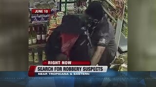 Police search for 2 robbery suspects