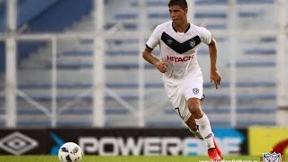 Lautaro Gianetti of Argentina's Velez Sarsfield, top, heads the