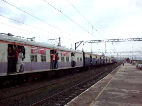 The Badlapur bound 12-coach 3XX AC-DC EMU silently cruises through Kopar station towards it's next scheduled halt Dombivli, which is barely a km away from Kopar