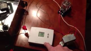 Thermostat controlled bathroom exhaust fan for cooling server room.
