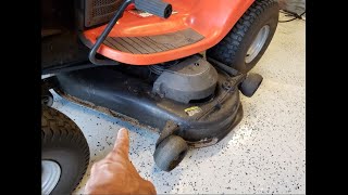 Adjust cutting deck height on a riding Husqvarna lawn mower