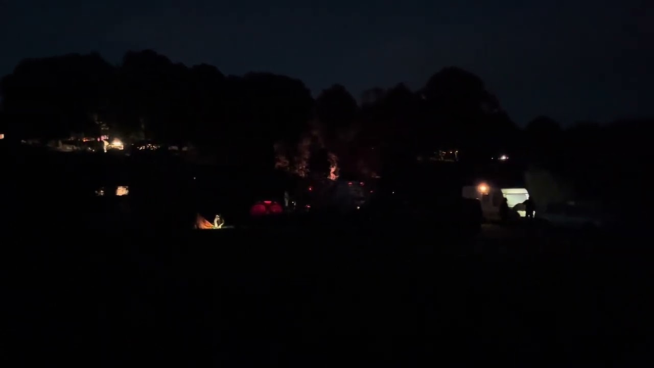 Braille Satellite 2023 - shot from across the campground with festival in the background