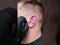 Epic viking ear tattoo by Simon Watkins! does tons of these