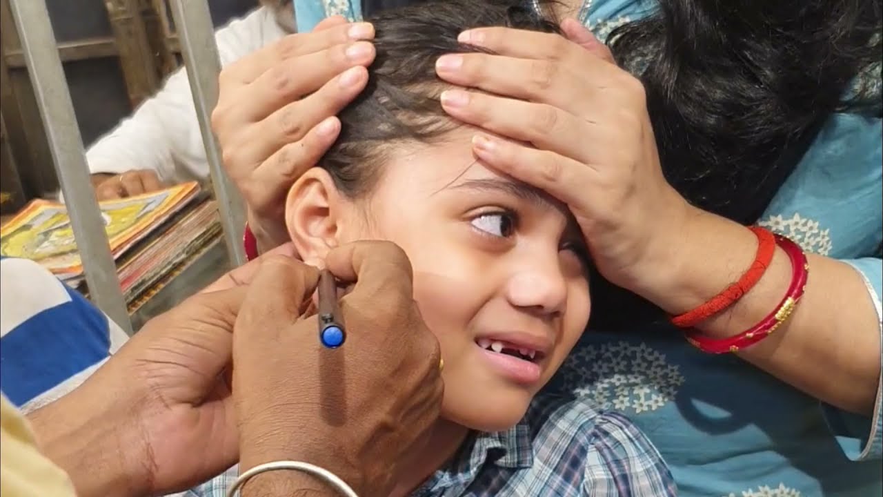 8 YEAR OLD GIRL'S EARS PIERCED! does piercing your ears hurt? YouTube