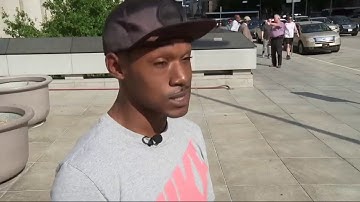 Man Goes Viral Shading Woman with Umbrella at Bus Stop