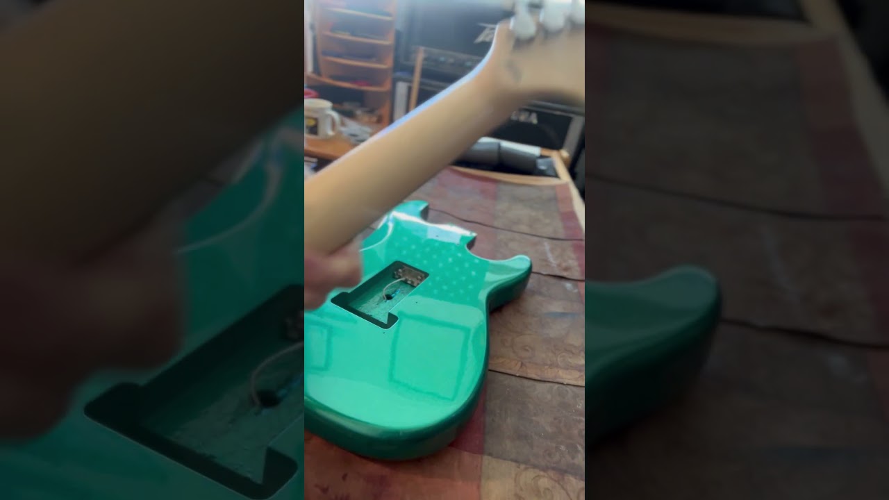 Preparing to assemble neck on custom emerald green Nema model ST – 25