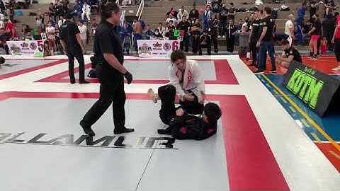 Brutal BJJ Loop Choke sleeps opponent 30 seconds into match at local tournament at blue belt.