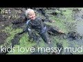 Kids go wild in a muddy swamp and have a mud fight!