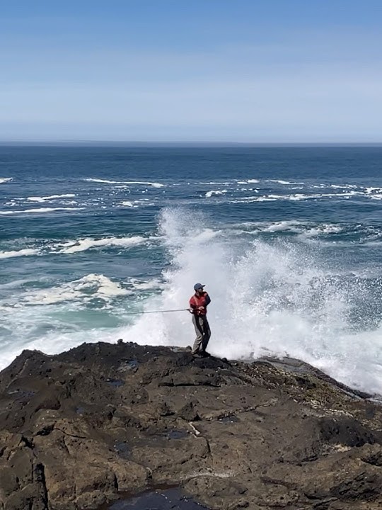 Shore fishing really rough water at the ocean.