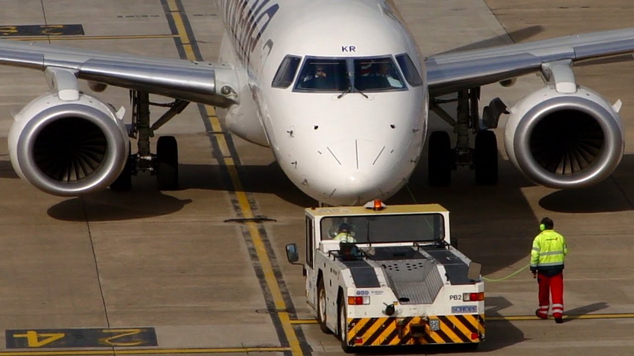 Embraer ERJ-190 close-up push back @ Manchester Airport