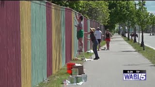 Bangor Beautiful begins latest project on Main Street fence