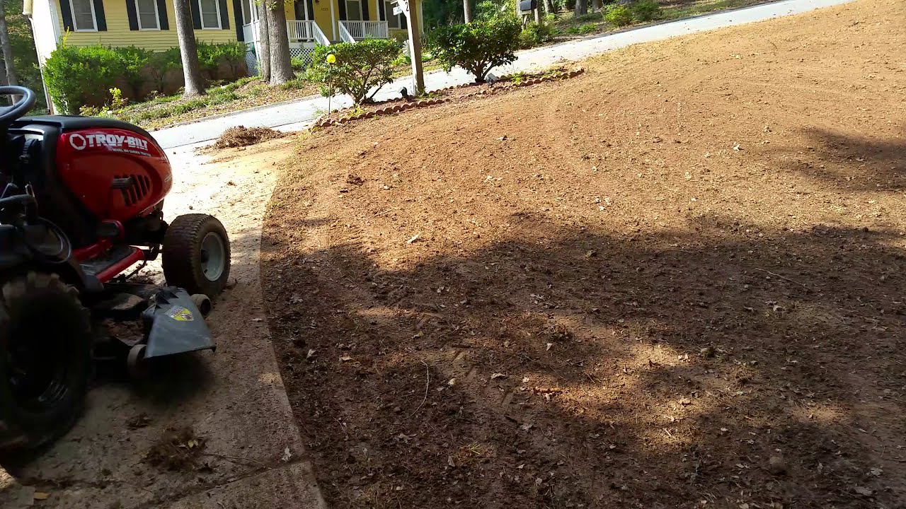 Using drag harrow to clean up debris on dirt and lawn works great