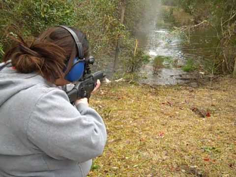 Christina shooting the Sig 522 into the creek again