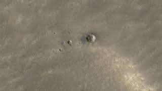 Martian crater with bright ice patch spotted from orbit