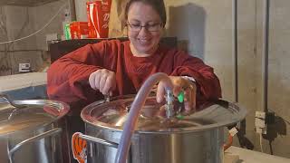 Filtering maple syrup using a Smoky Lake stainless steel filter press.