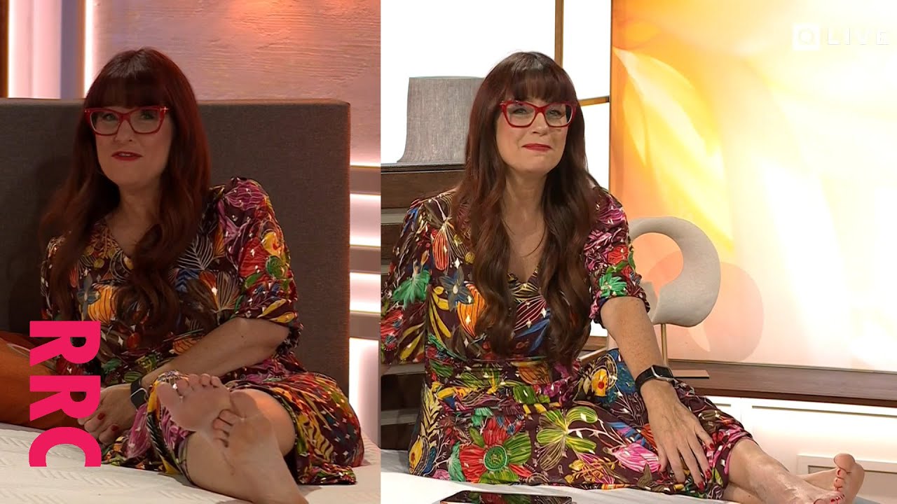 Catherine Huntley @barefoot on bed in multi-chocolate print dress