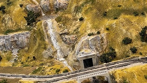 Building up the water features on my N  Scale Scenic Ridge layout using Mod Podge to simulate water