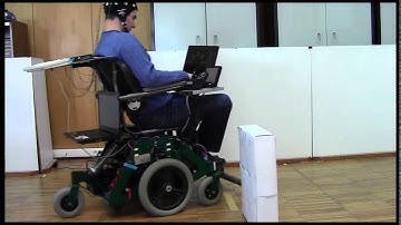 RobChair: Experiments Evaluating Brain-Computer Interface to Steer a Semi-autonomous Wheelchair