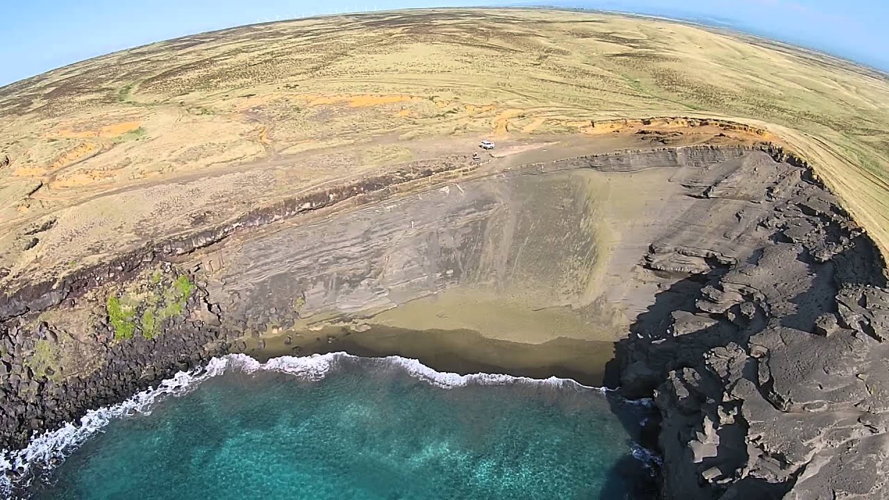 adventures of aladdin View of Green Sand Beach From Pacific Ocean - Drone Aerial View - Big Island Hawaii