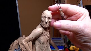 THE HUNTED   Sill working on the cloths and starting the face of the Warrior on the Rock
