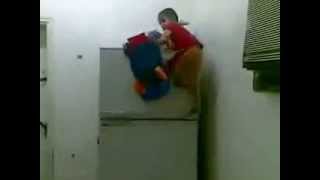 amazing Kid climbs fridge