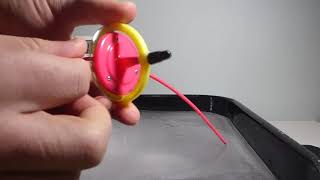Small Toy Gyroscope with Plastic Stem on Grooved Ice Wobbles and Case Spins. Stopped at 0:35