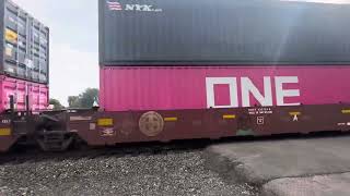 Westbound NS intermodal with a BNSF warbonnet 