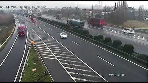 Reckless Driver Missed Exit Causes Two Semi Trucks to Crash Spectacularly