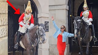 Guard Stands In The Stirrups To Help His Horse Pee