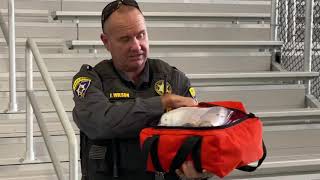 Mohave County Sheriff John Wilson handed out life saving "FIDO" bags