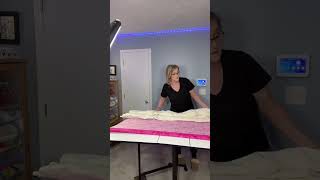 Basting a quilt, using long boards. a great way to base a quilt easily.