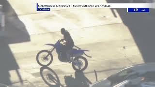 Aerials of police chasing a dirt bike in CA.