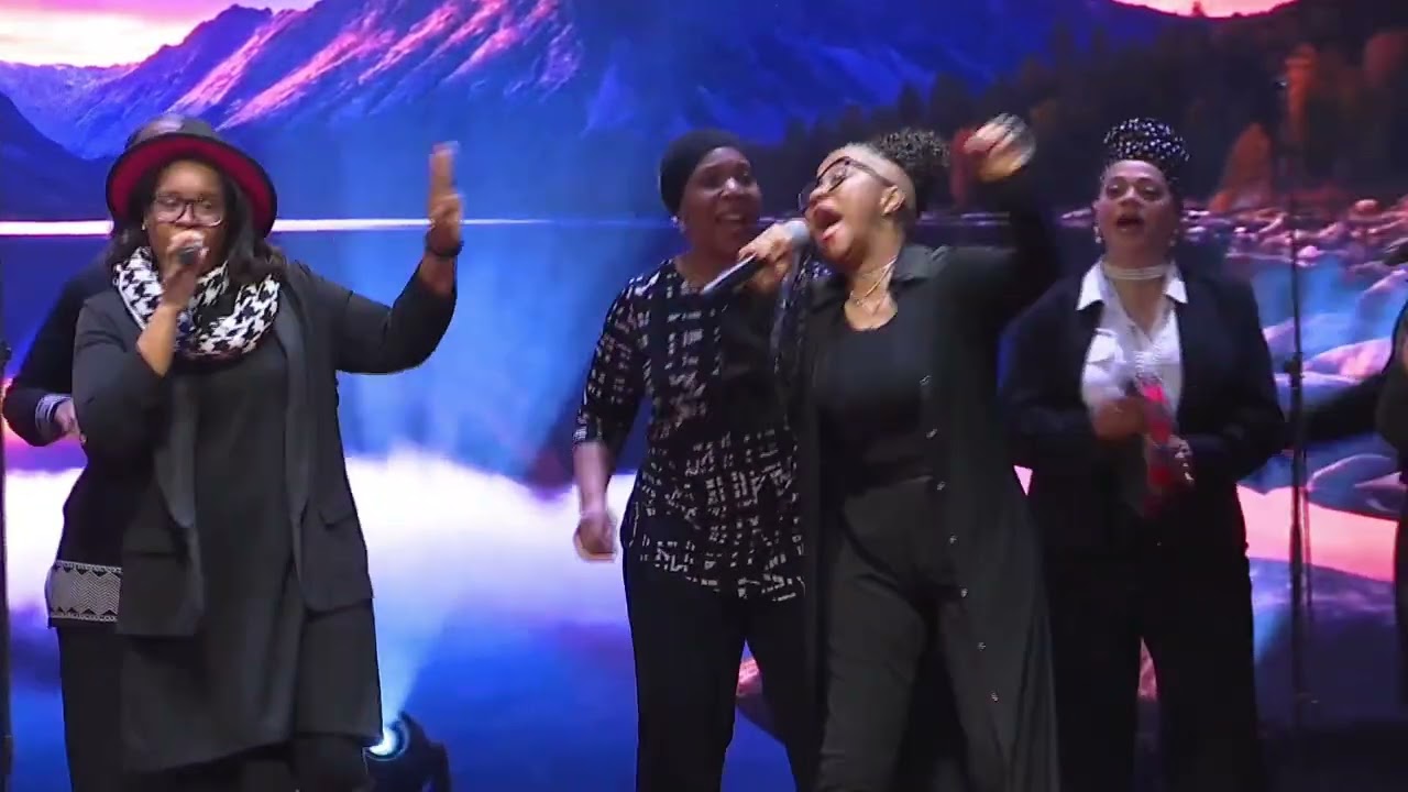 Word of Faith Love Center's choir singing "I Will Bless The Lord"