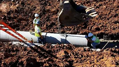 Installing concrete pipe in the trench