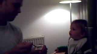 Baby laughing of father's funny sneeze