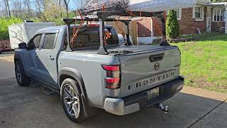 Loaded up TruXedo Elevate adjustable Bed Rack Nissan Frontier full load for trade show displays