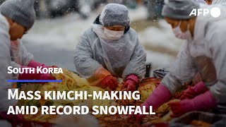 South Korea holds mass kimchi-making event amid record snowfall | AFP