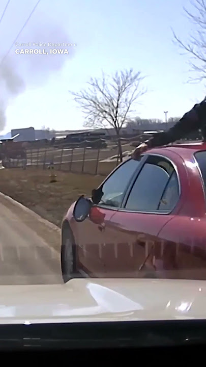 'Stop the car!': Man attempts to evade police with officer clinging to windshield #Shorts